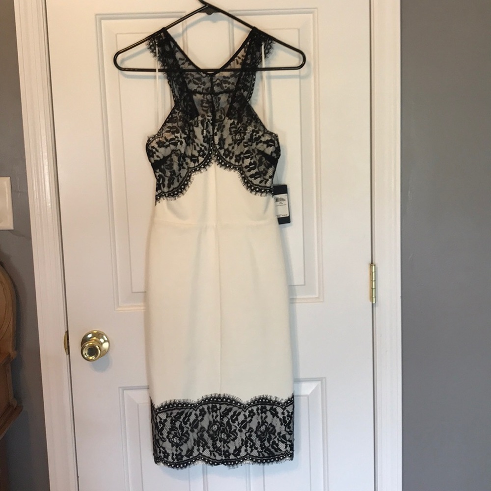 White bodycon dress with black lace